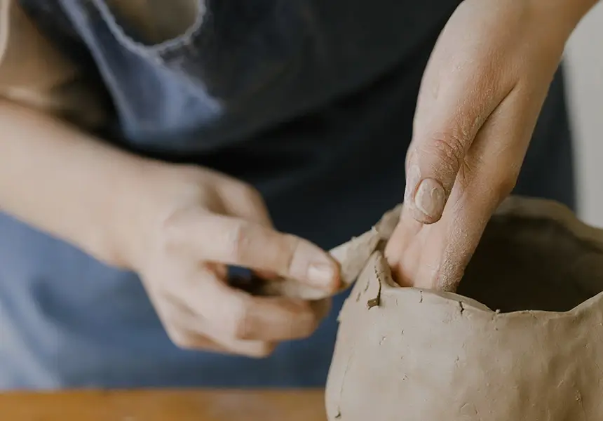 Hands that make clay pots